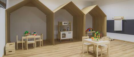Una habitación con zona de cocina, muebles de madera y una pared blanca con ventana.