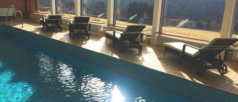 Indoor pool, open 7:30 AM to 8:30 PM, pool umbrellas, sun loungers