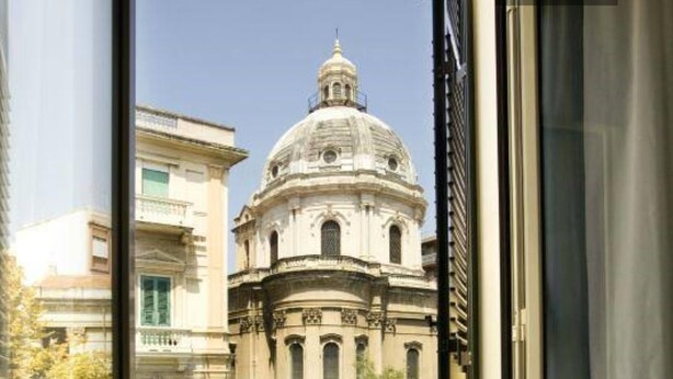 A historic building with a prominent dome and classical architecture.