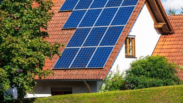 A house with a sloped roof covered in solar panels. - Stupor Mundi (Altamura)