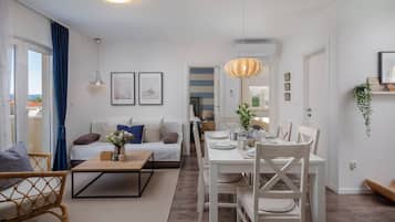 Family Apartment, Ocean View | Living area | Flat-screen TV