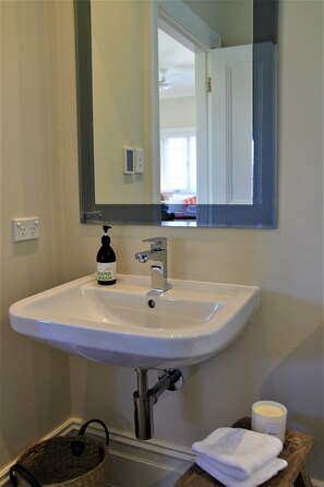 Combined shower/bathtub, hair dryer, towels, toilet paper