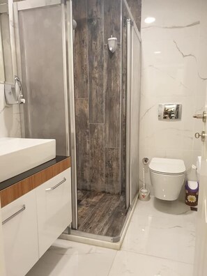 Apartment, 2 Bedrooms | Bathroom | Shower, free toiletries, hair dryer, towels - V&M House (Mersin)