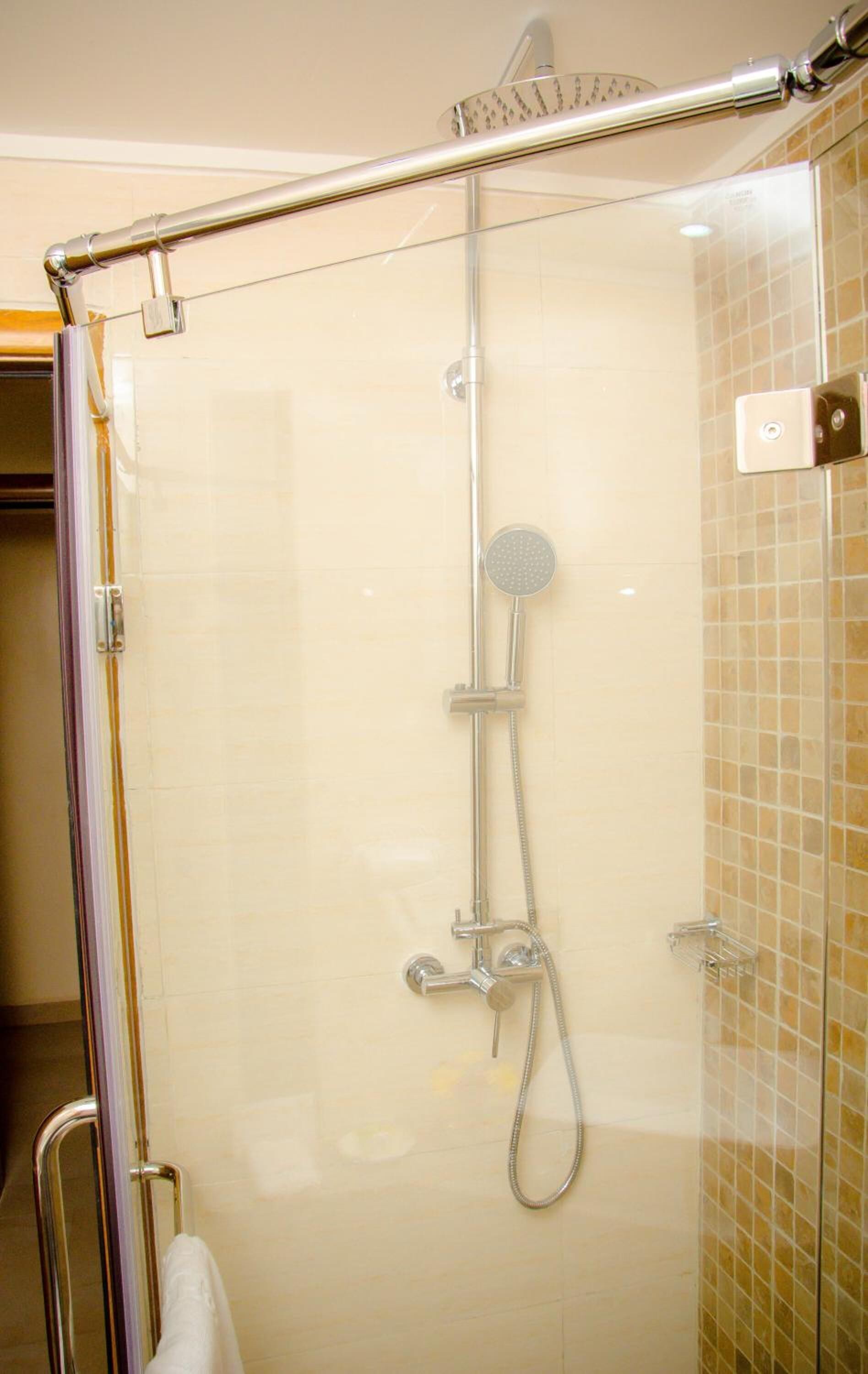 shower, rainfall showerhead, designer toiletries, hair dryer