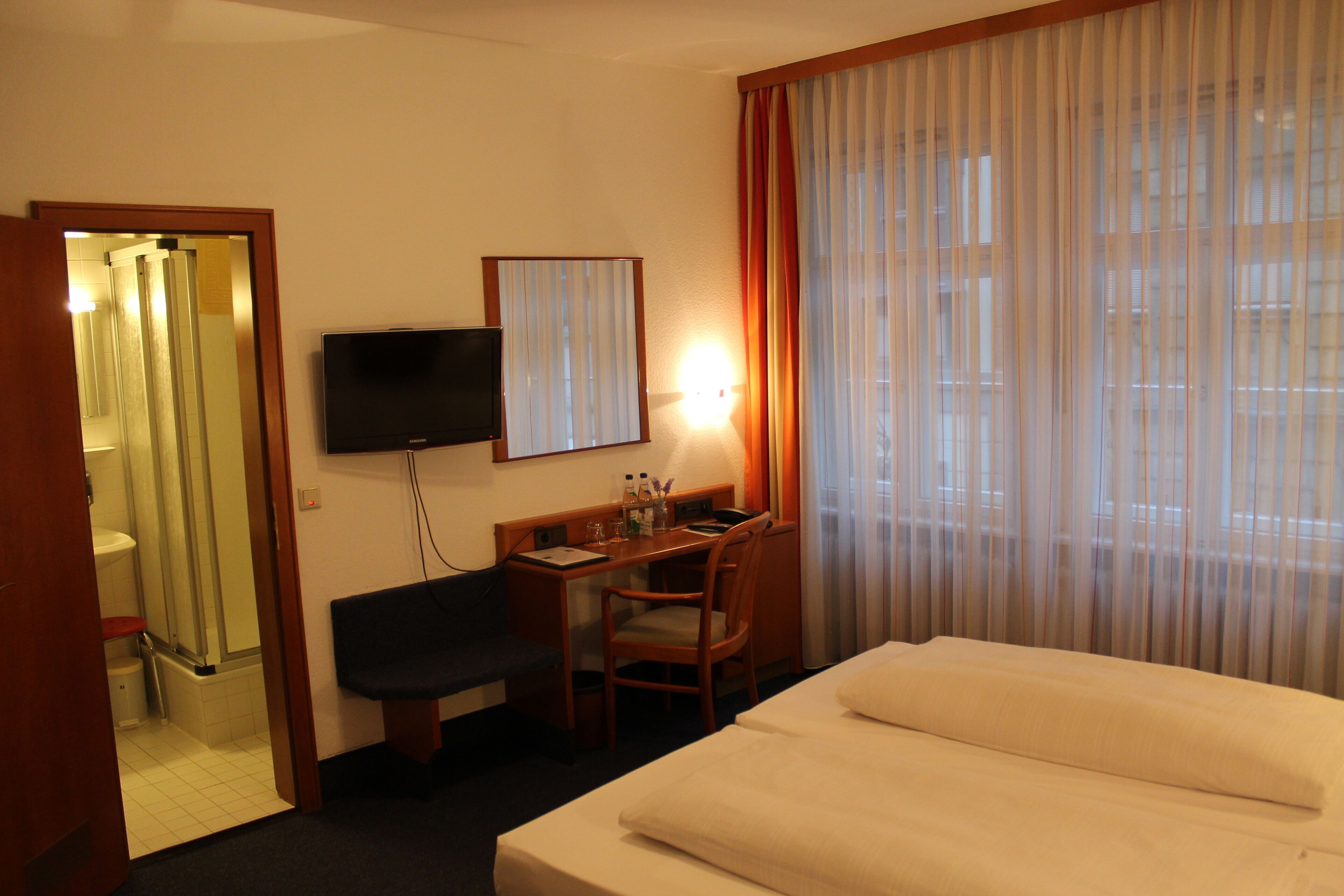 standard double room | bathroom | shower, hair dryer, towels