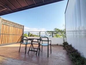 Basic Quadruple Room, 2 Queen Beds, Patio, Ground Floor | Terrace/patio - Kumokuru (Taichung)