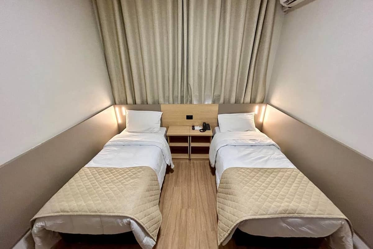 Standard Twin Room | Minibar, in-room safe, desk, soundproofing