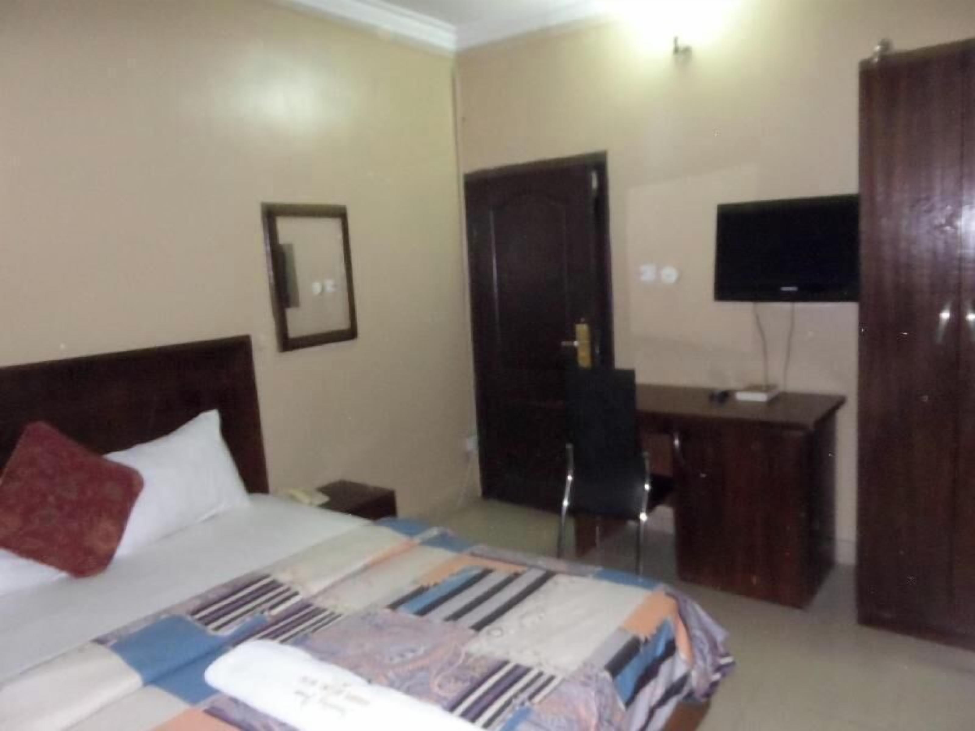 Desk, laptop workspace, bed sheets