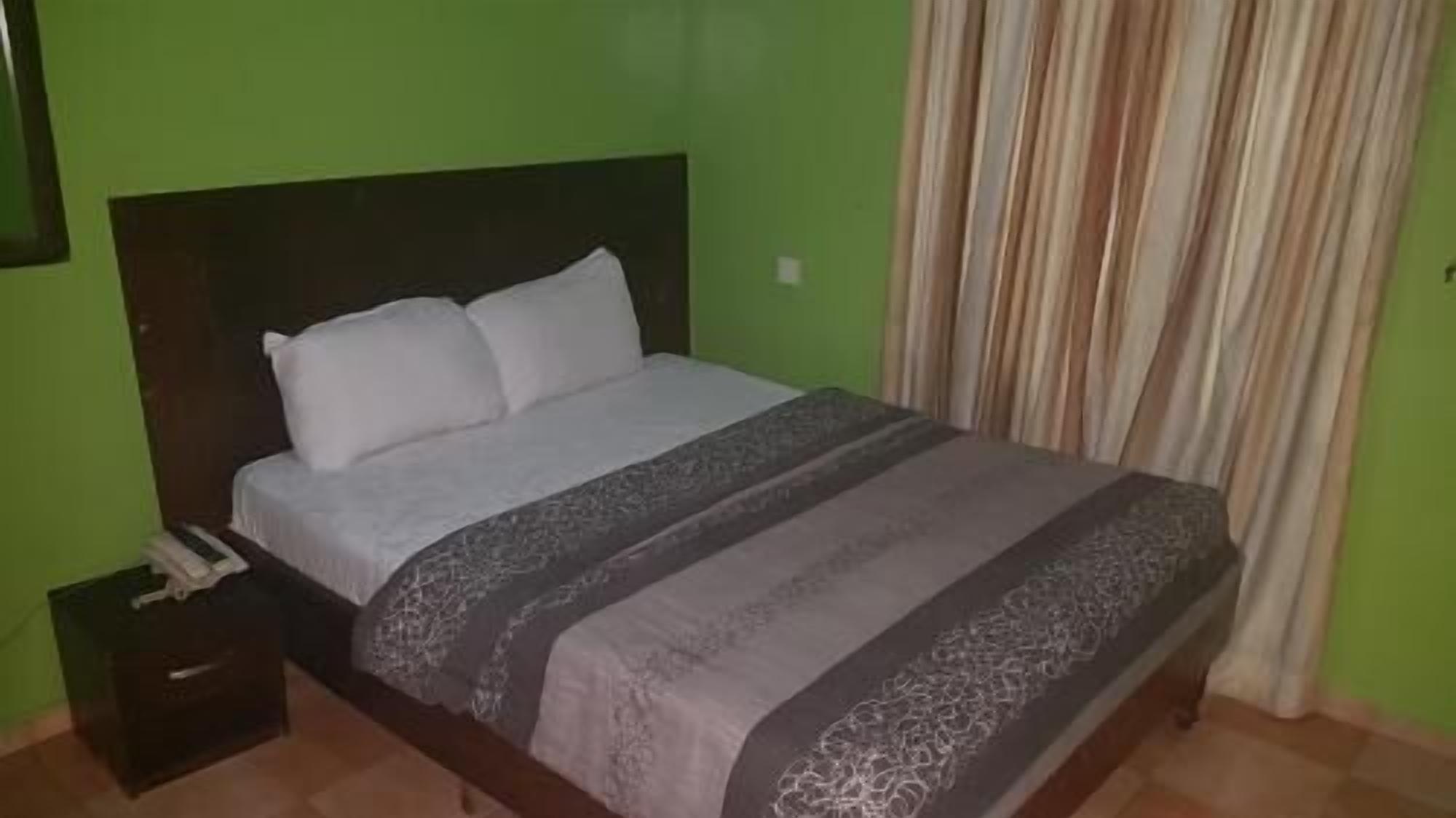 Desk, laptop workspace, bed sheets
