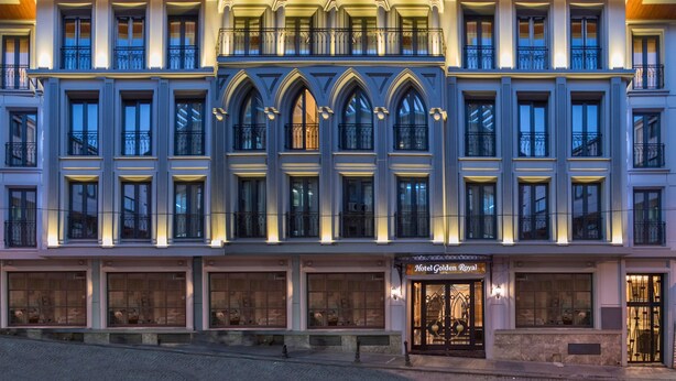 A multi-story hotel with a classic architectural design, featuring large windows and a prominent entrance with a sign reading "Hotel Golden Royal". - Golden Royal Hotel & Spa (Istanbul)