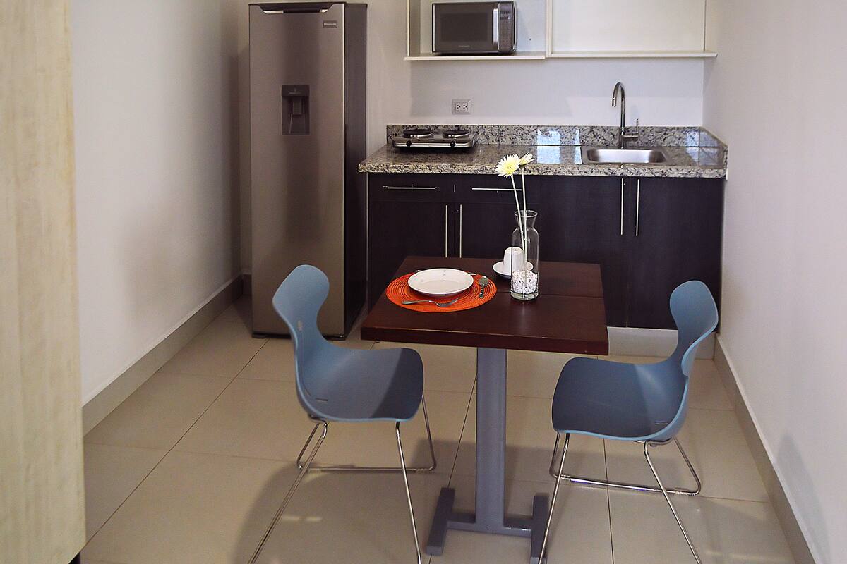 superior studio suite, 1 queen bed | private kitchen | coffee/tea maker