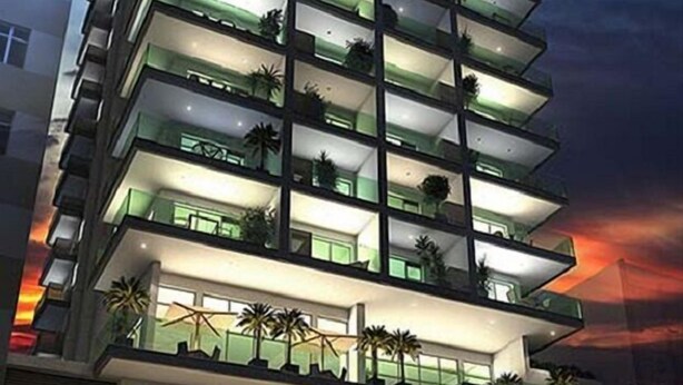 A multi-story hotel with balconies, a covered entrance, and a modern architectural design. - London Residencial Design (Niteroi)