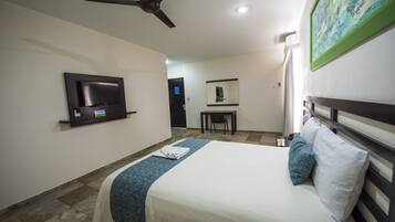 Habitación ejecutiva | Ropa de cama de alta calidad y minibar