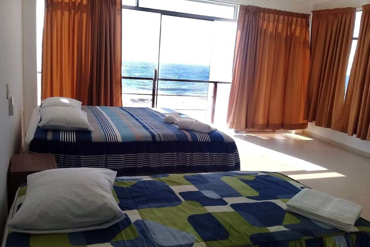 Habitación con 2 camas individuales, vista al océano | Camas extra, wifi gratis y ropa de cama