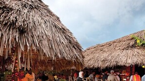 A beachside restaurant with thatched roofs and outdoor seating. - Hospitality Expert CB1 (Montego Bay)
