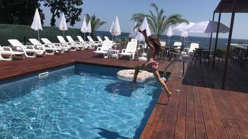 Seasonal outdoor pool, pool umbrellas, sun loungers