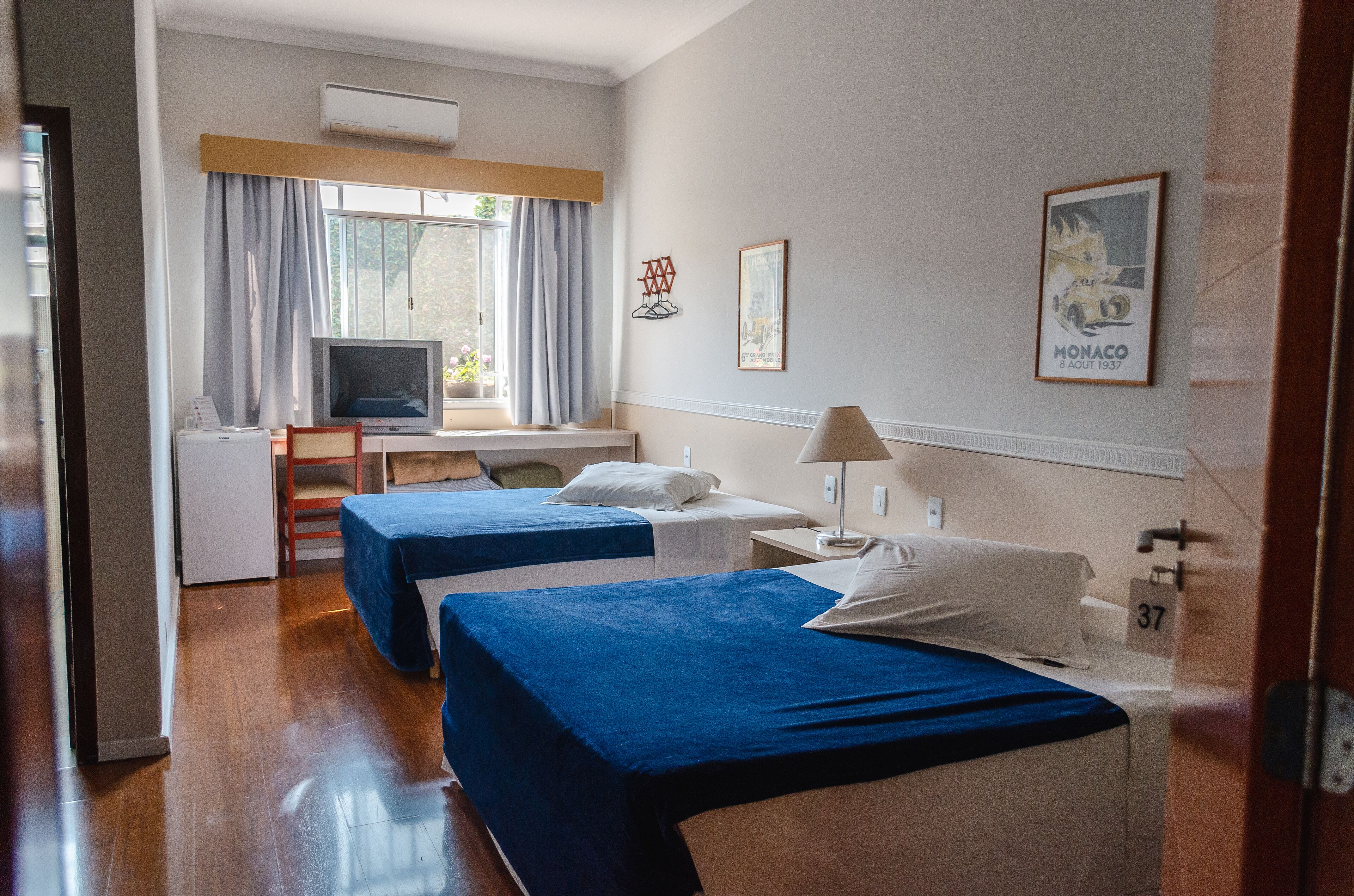 family room, multiple beds | 1 bedroom, minibar, desk, iron/ironing board