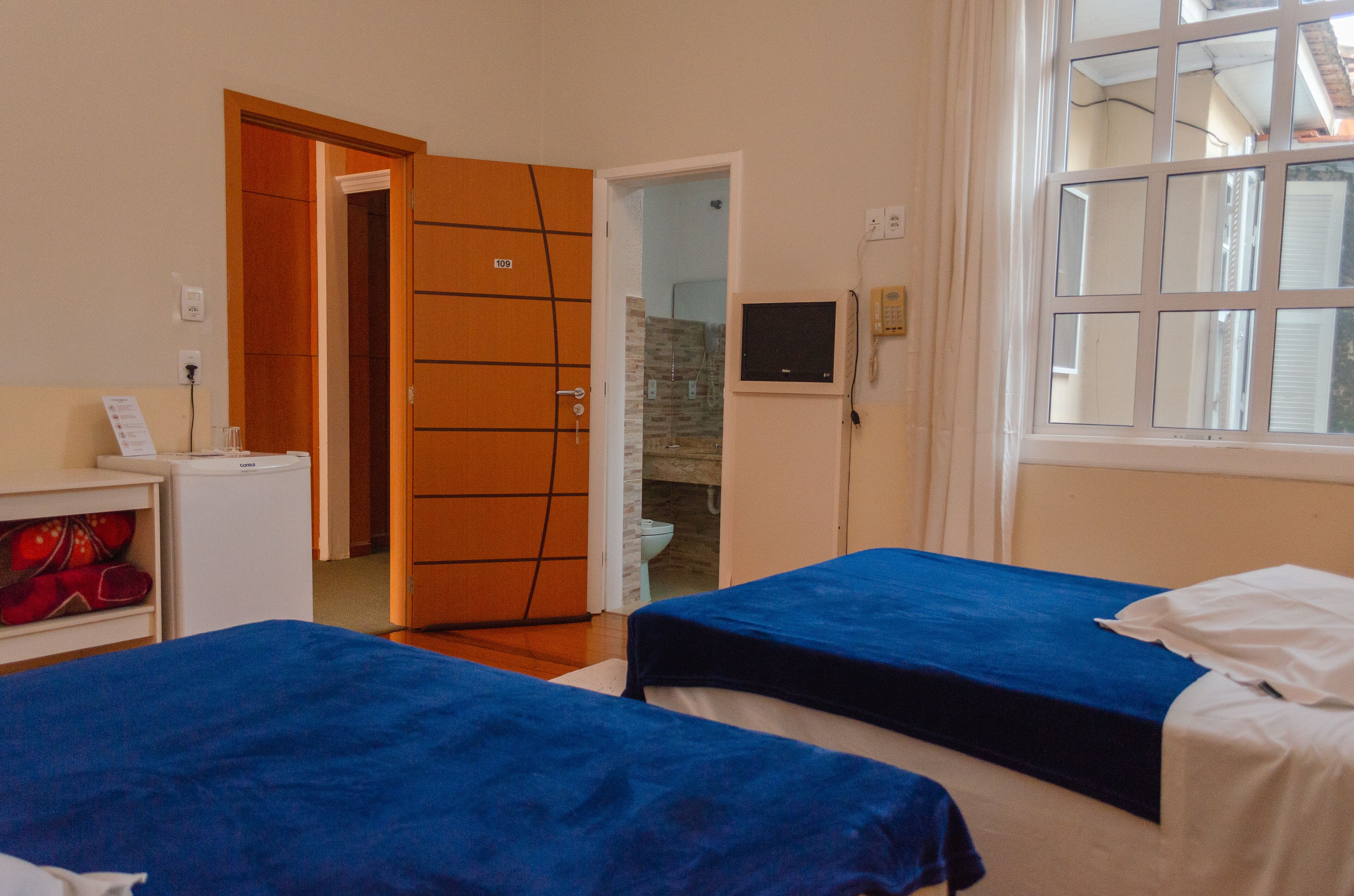 luxury quadruple room, 2 queen beds | 1 bedroom, minibar, desk, iron/ironing board