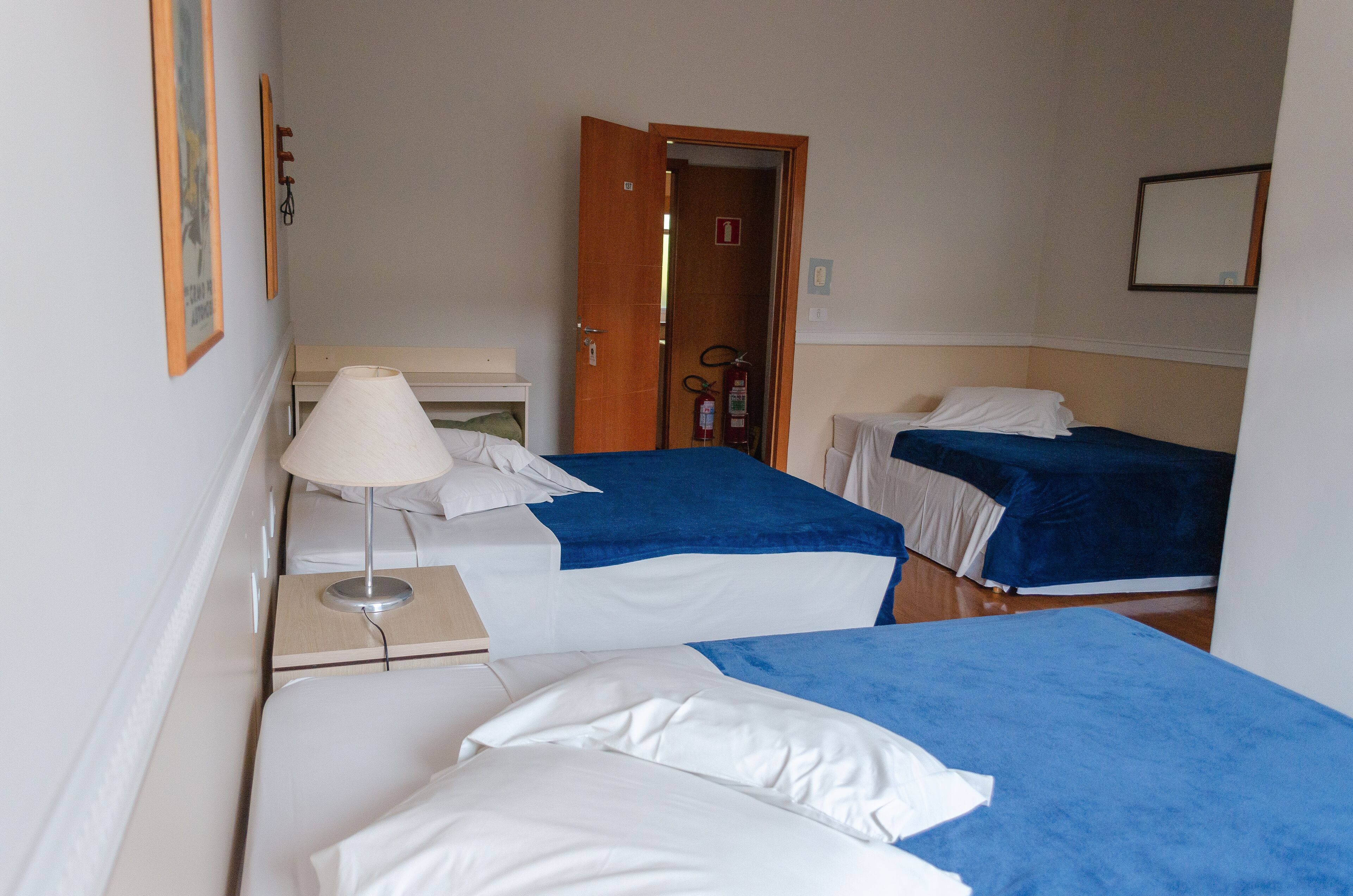 family room, multiple beds | 1 bedroom, minibar, desk, iron/ironing board