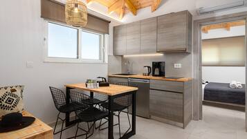 Family Suite, Multiple Bedrooms, 2 Bathrooms | Private kitchen