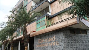 A building with a sign reading "Emmad Furnished Hotel". - Emmad Apartment Hotel (Addis Ababa)