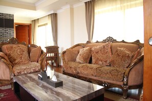 Apartment, 2 Bedrooms | Living area | 32-inch Smart TV with satellite channels, TV - Emmad Apartment Hotel (Addis Ababa)