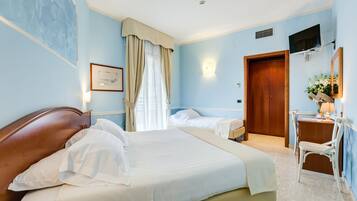 Standard Triple Room, Multiple Beds | Minibar, in-room safe, desk, iron/ironing board