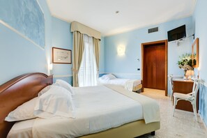 Standard Triple Room, Multiple Beds | Minibar, in-room safe, desk, iron/ironing board