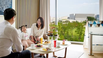 Enjoy a city view from the large window, with a dining area and comfortable seating for a relaxing stay.