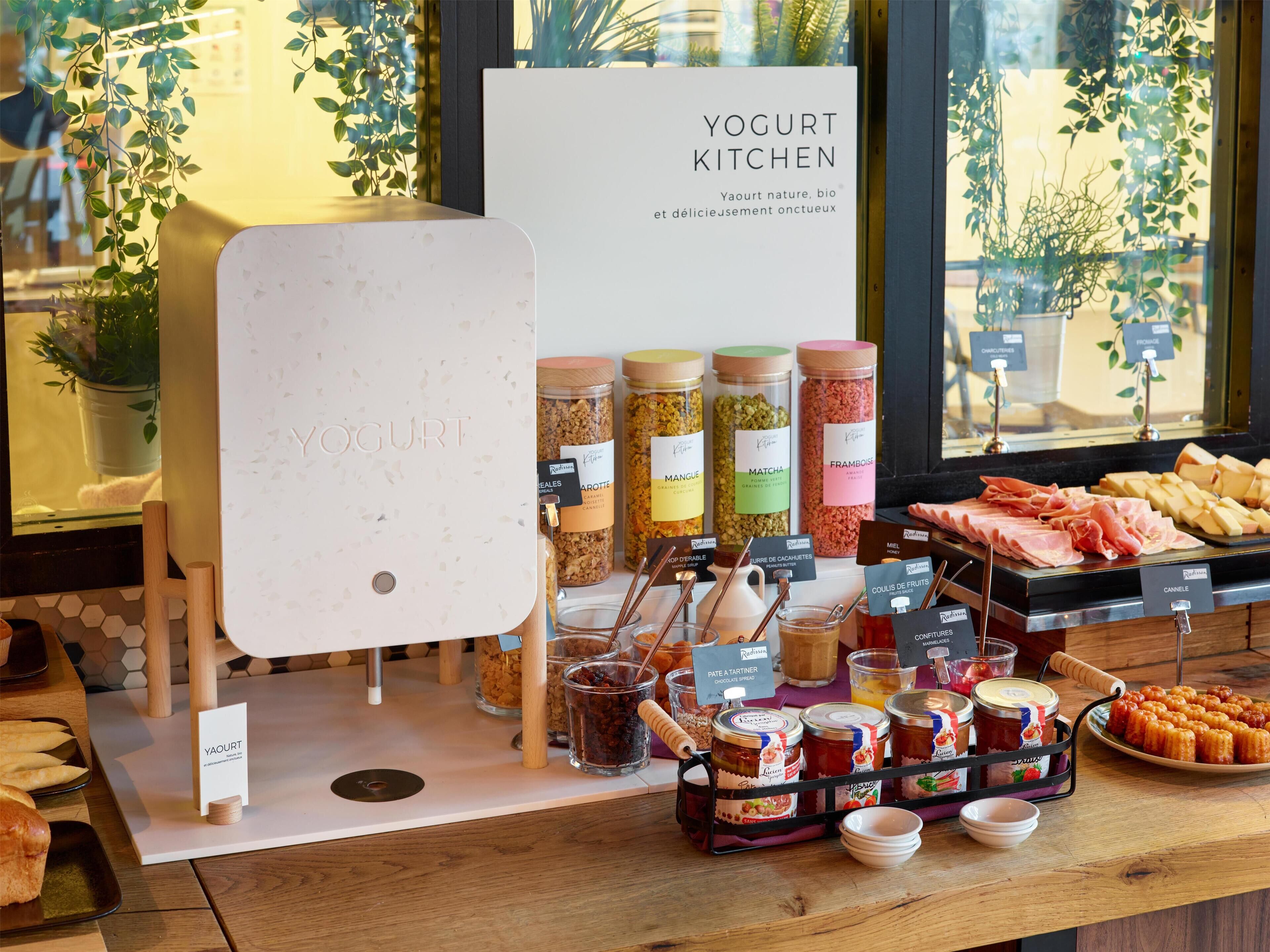A display of yogurt products and deli items at a restaurant.