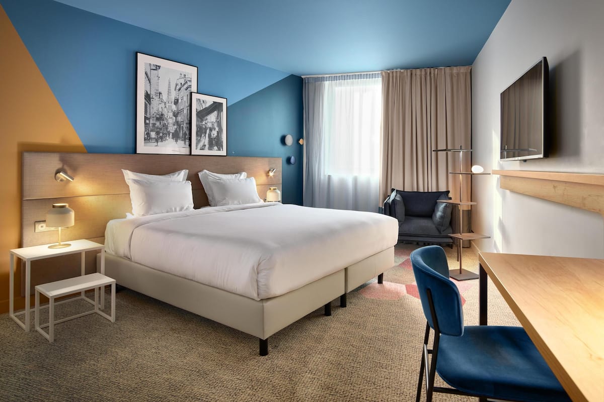 Habitación superior | Ropa de cama de alta calidad y minibar