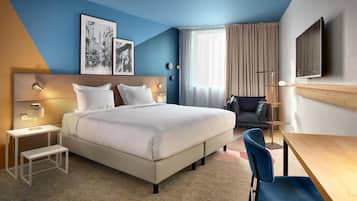 Superior kamer | Luxe beddengoed, een minibar, een kluis op de kamer, een bureau