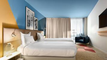 Luxe beddengoed, een minibar, een kluis op de kamer, een bureau