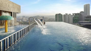 2 outdoor pools, open 7:00 AM to 10:00 PM, pool loungers
