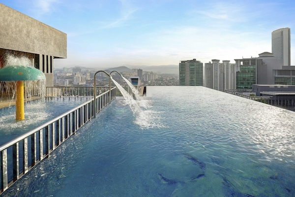 2 outdoor pools, open 7:00 AM to 10:00 PM, pool loungers