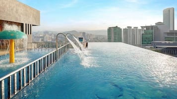2 outdoor pools, open 7:00 AM to 10:00 PM, pool loungers