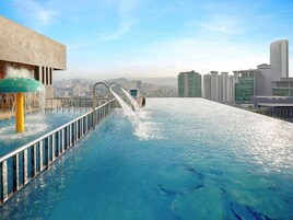 2 outdoor pools, open 7:00 AM to 10:00 PM, pool loungers