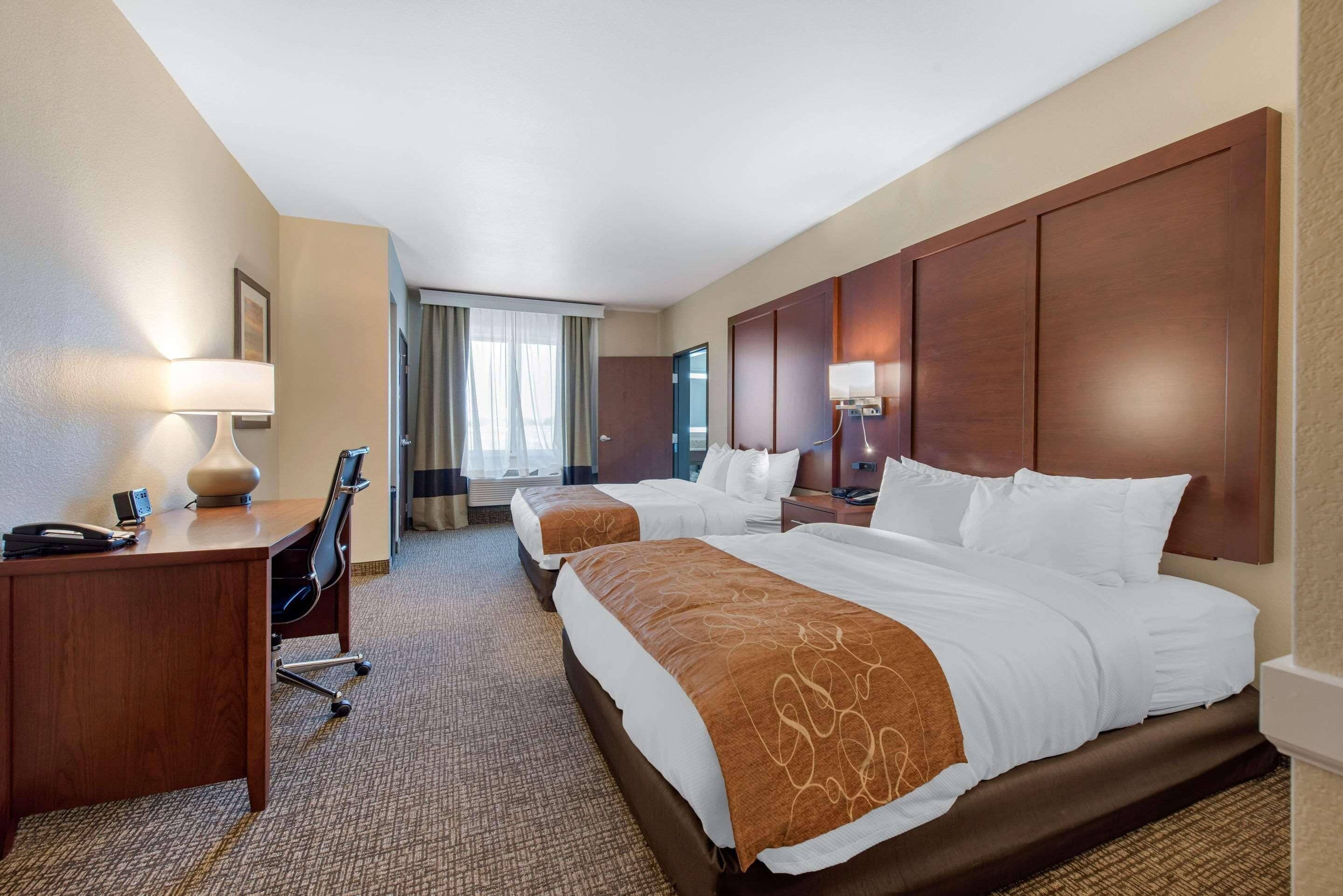 Premium bedding, desk, laptop workspace, blackout curtains