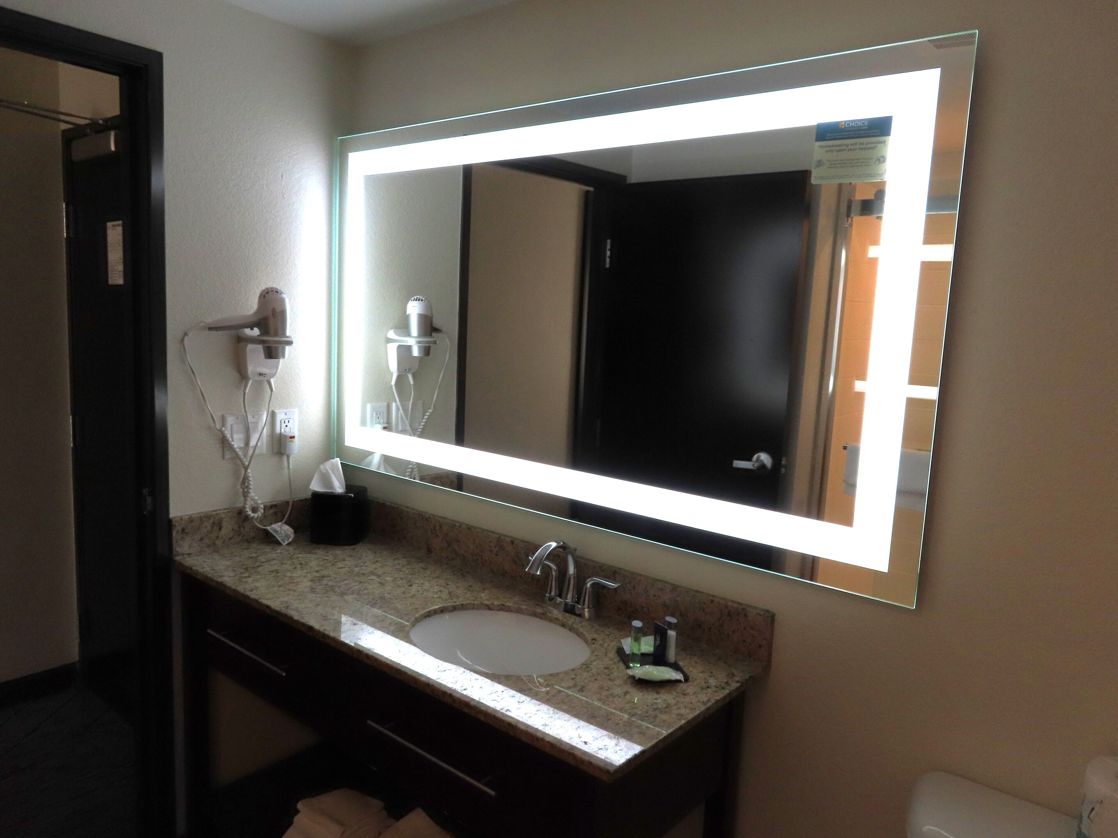 designer toiletries, hair dryer, slippers, towels