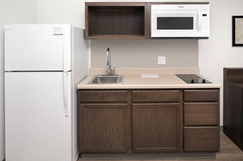 Desk, blackout drapes, iron/ironing board, free WiFi at WoodSpring Suites San Antonio Stone Oak