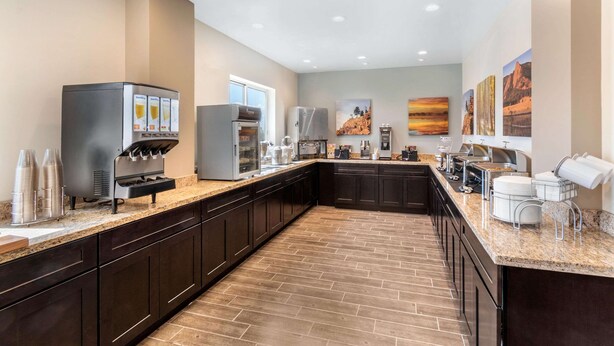 A modern kitchen with a coffee station, a refrigerator, and a microwave. - Sleep Inn & Suites Denver International Airport (Denver)