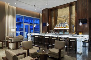 3 bars/lounges, rooftop bar, lobby lounge