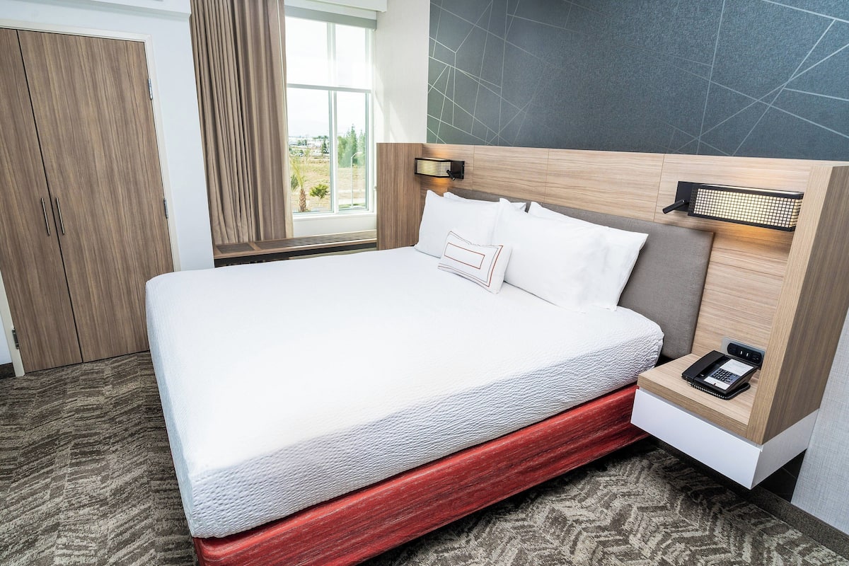 desk, blackout curtains, iron/ironing board, cots/infant beds