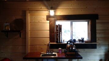 Stovetop, coffee/tea maker, cookware/dishes/utensils, dining tables