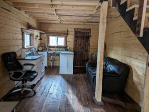 Cabin | Private kitchen | Stovetop, coffee/tea maker, cookware/dishes/utensils, dining tables