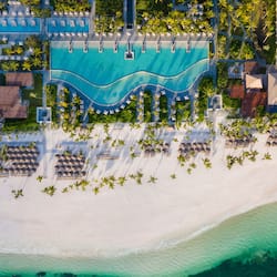 On the beach, white sand, sun-loungers, beach umbrellas