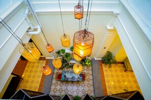 A staircase with hanging wicker lamps and patterned floor tiles. - Aava Malacca Hotel (Malacca City)