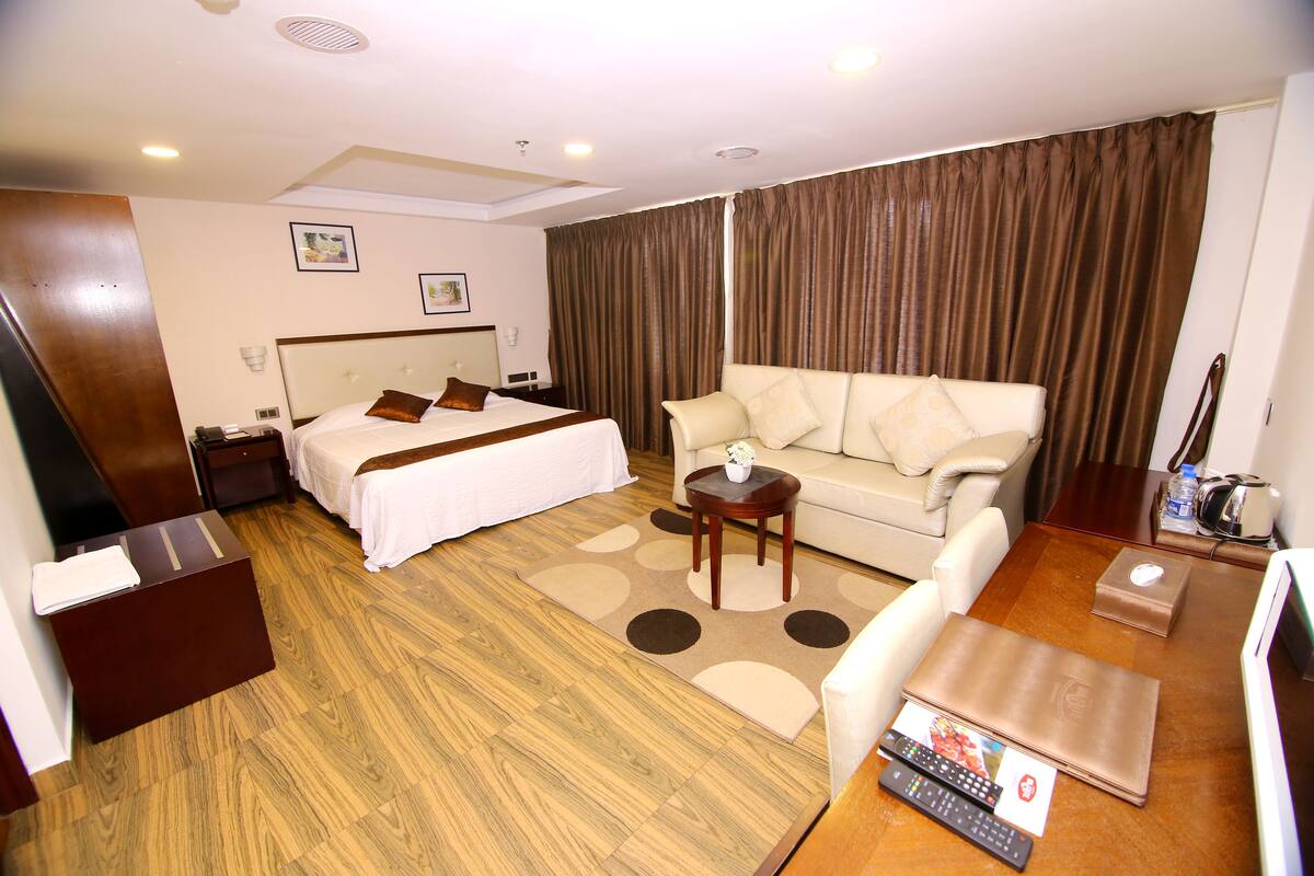 elite deluxe room | premium bedding, in-room safe, desk, soundproofing