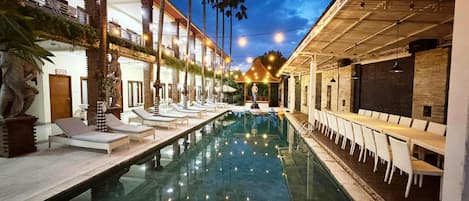 Outdoor pool, open 7 AM to 9 PM, pool umbrellas, pool loungers