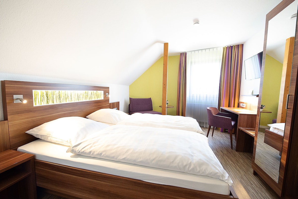 Hypo-allergenic bedding, down comforters, desk, laptop workspace